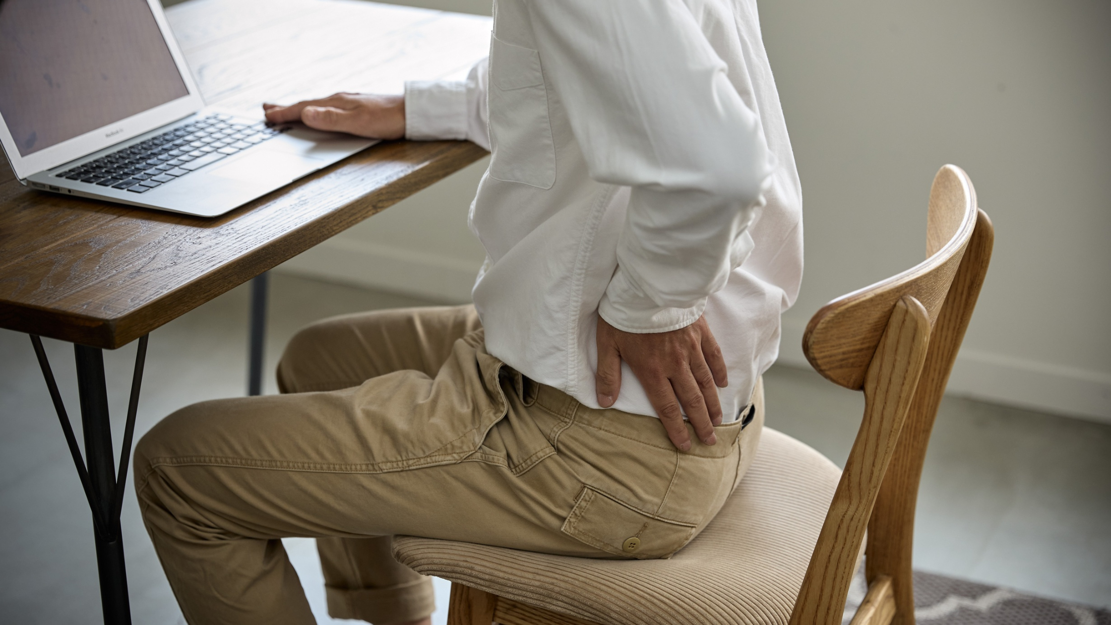 A person expressing the physical and emotional burden of recurring sciatica, highlighting the frustration of persistent nerve pain and the desire for a lasting solution that restores daily mobility.